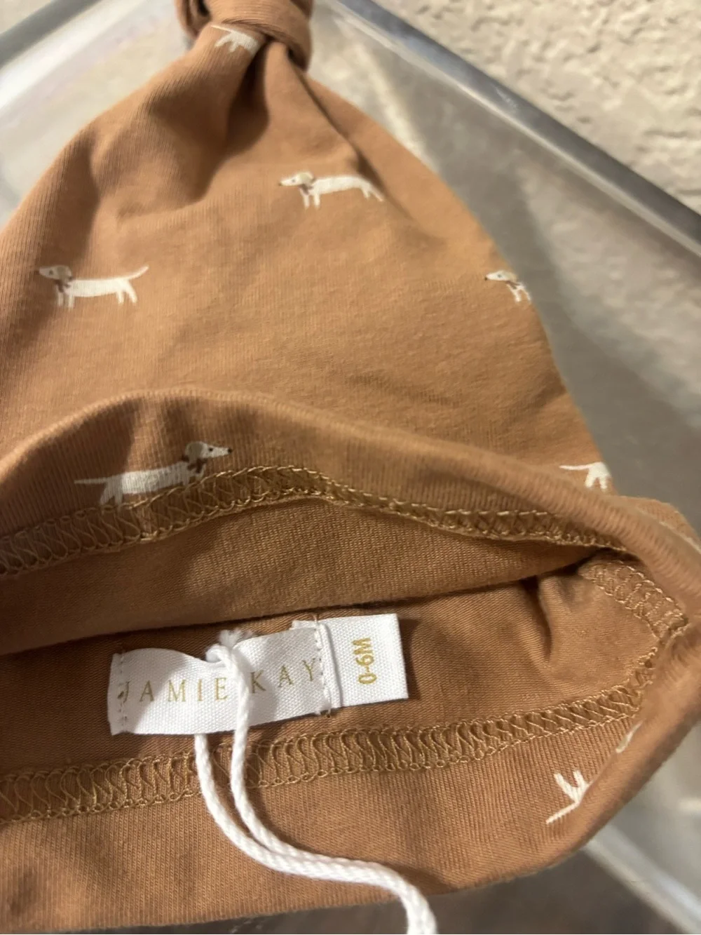 Jamie Kay Tan Knot Baby Hat with Cream Dog Print